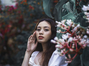 Portrait of woman with pink flowers