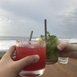 Cropped image of hand holding drink