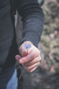 Close-up of person holding hand