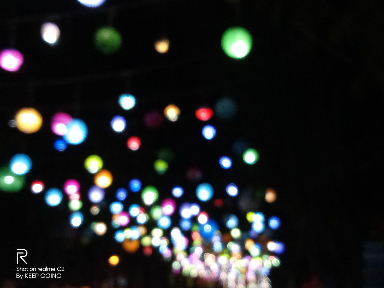 DEFOCUSED IMAGE OF ILLUMINATED LIGHTS