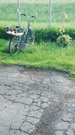 Bicycle parked on grass