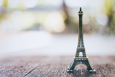 Close-up of model eiffel tower against blurred background