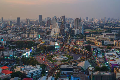 High angle view of multiple lane highway amidst buildings in city