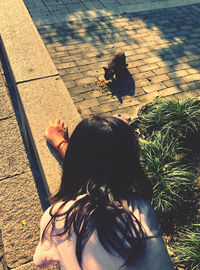 High angle view of woman on footpath