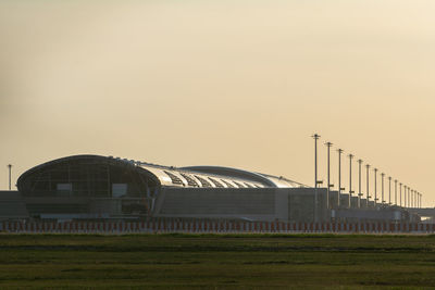 Built structure on field against clear sky