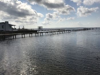 Pier over sea against sky