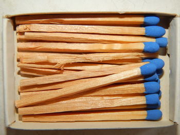 Directly above shot of matchsticks in box