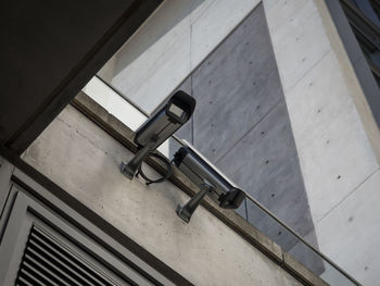 High angle view of security camera on concrete wall