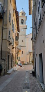 Narrow street amidst buildings in town