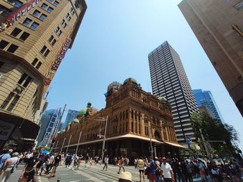 Low angle view of buildings in city against sky