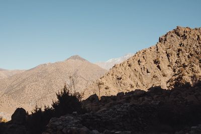 Scenic view of rocky mountains against clear sky