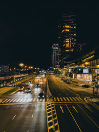 High angle view of illuminated city street at night