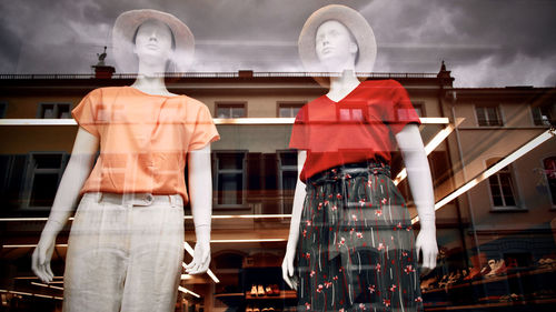 Rear view of people walking on street