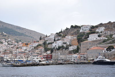 Townscape by sea against sky