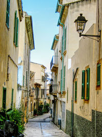 Alley amidst buildings in city