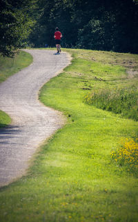 Mid distance of man running on road