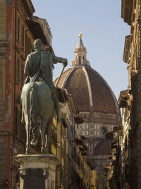 Statue of historic building against sky