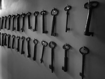 High angle view of keys hanging on wall