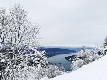 Scenic view of snow covered landscape against sky