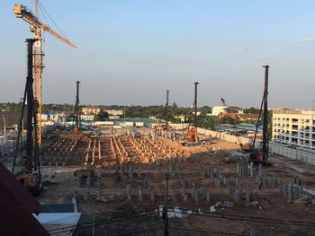 Panoramic view of construction site against buildings in city