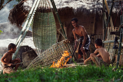 Thailand's father and son are making bamboo baskets or fishing gear by hand. thailand's everyday