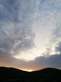 Low angle view of silhouette mountain against sky during sunset