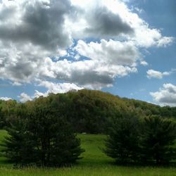 Scenic view of landscape against cloudy sky