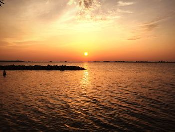 Scenic view of sea at sunset