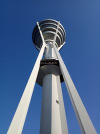 Low angle view of tower against clear blue sky