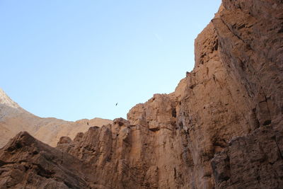 Low angle view of rocky mountains at wadi og