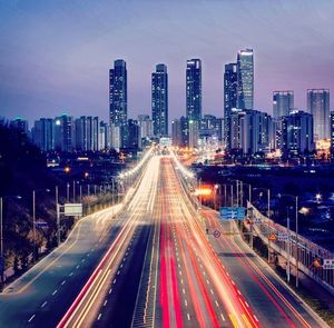 Illuminated city street at night