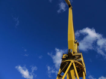 Low angle view of communications tower against sky