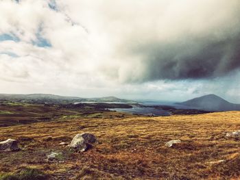 Scenic view of landscape and lake against sky