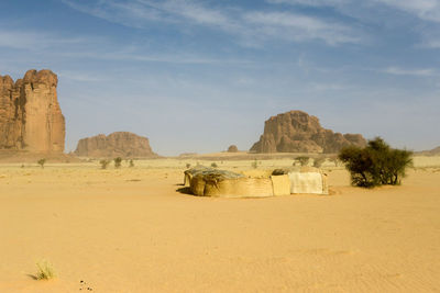 Rock formations in desert against sky