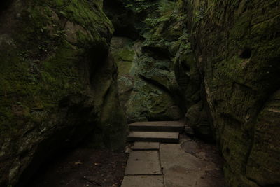 Footpath amidst rocks in cave