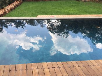 Reflection of clouds in swimming pool