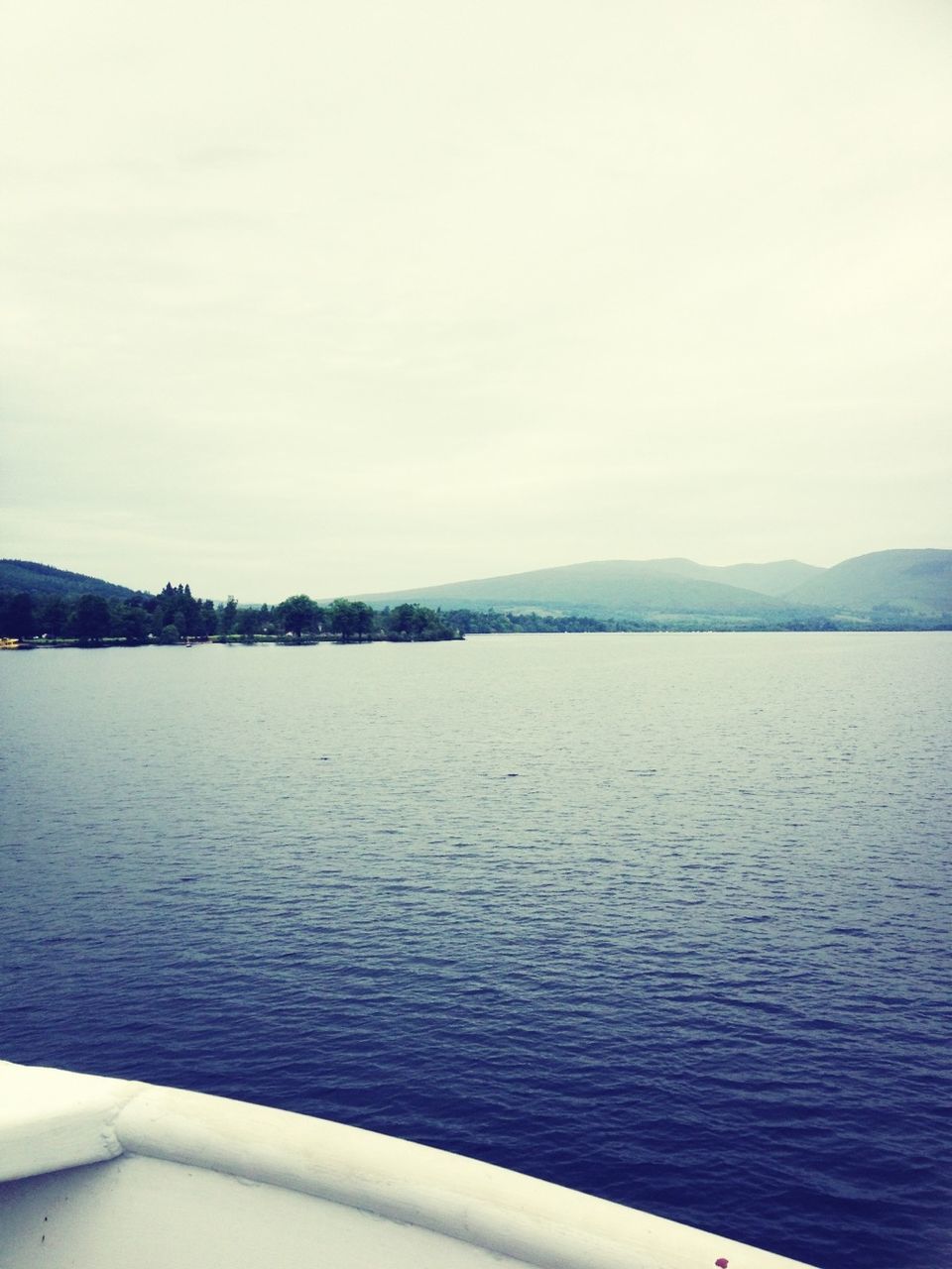 water, tranquil scene, tranquility, scenics, mountain, lake, beauty in nature, clear sky, nature, copy space, waterfront, rippled, sky, idyllic, mountain range, sea, calm, river, day, outdoors