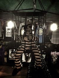 Blurred motion of woman standing at night