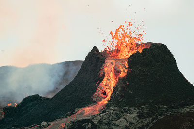 Scenic view of volcanic mountain against sky