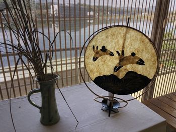 High angle view of bird perching on table