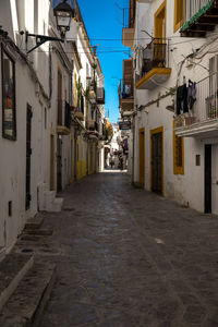 Narrow alley amidst buildings in city