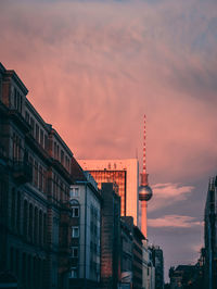 Fernsehturm against sky during sunset