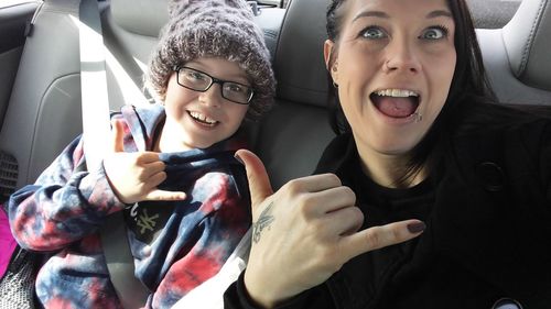 Portrait of happy woman in car