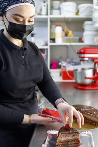 Midsection of man preparing food at home