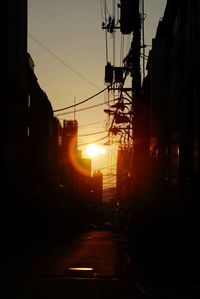 Silhouette of city street during sunset