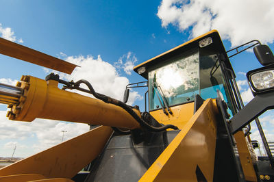 Low angle view of machinery against sky