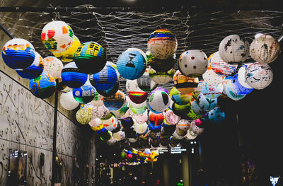 Low angle view of lanterns hanging for sale at market