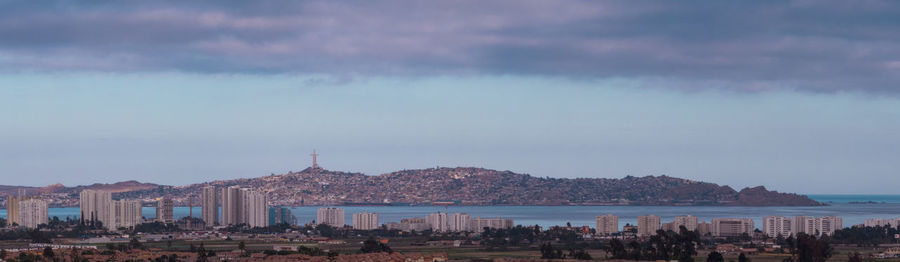 View of beach with city in background