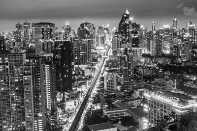 The cityscape, the skyscrapers and buildings of bangkok in thailand asia during the night timeline