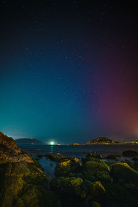 Scenic view of sea against sky at night